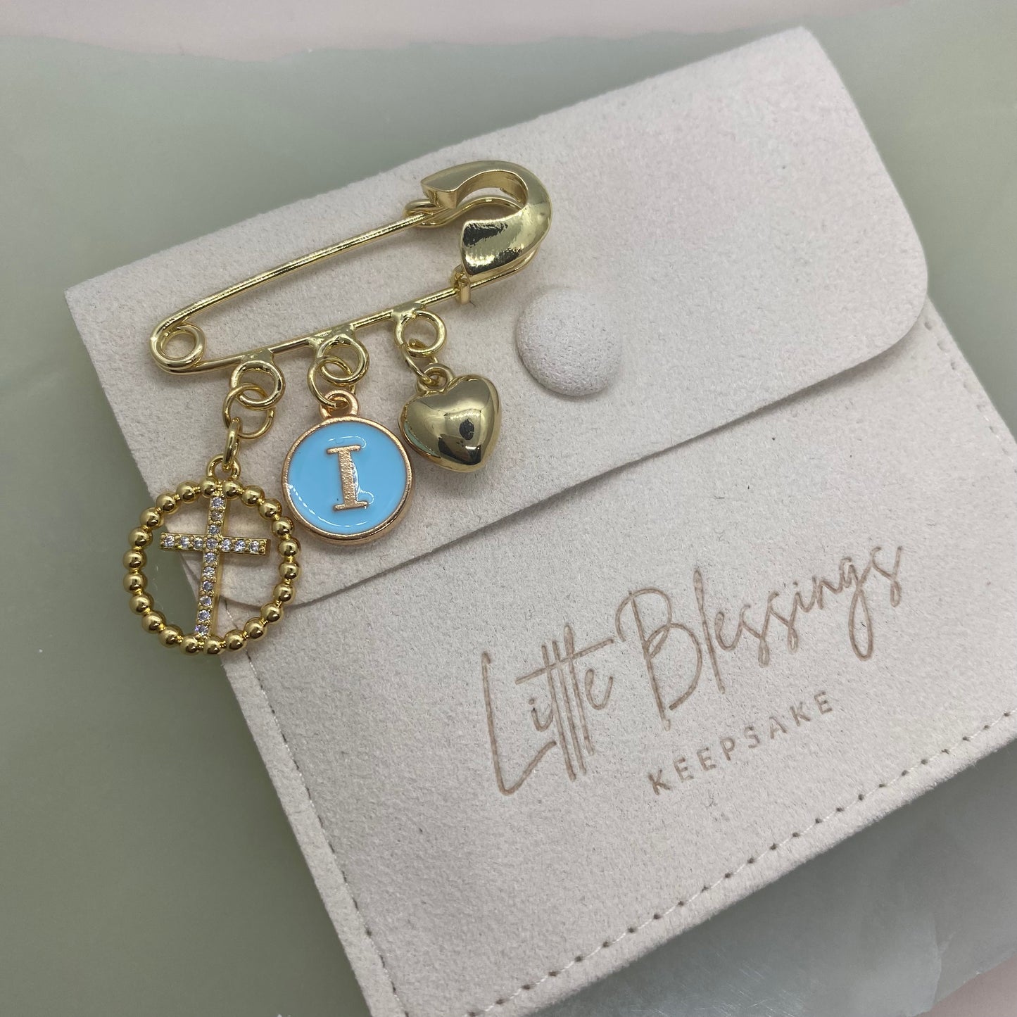 CIRCLE DIAMANTÉ CROSS CHARM