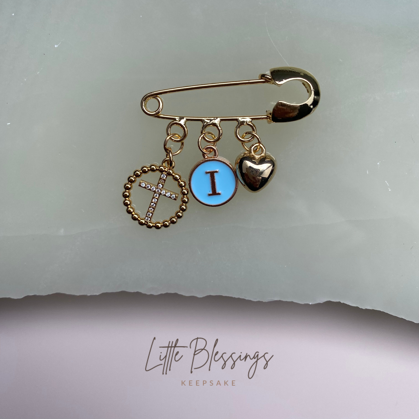 CIRCLE DIAMANTÉ CROSS CHARM